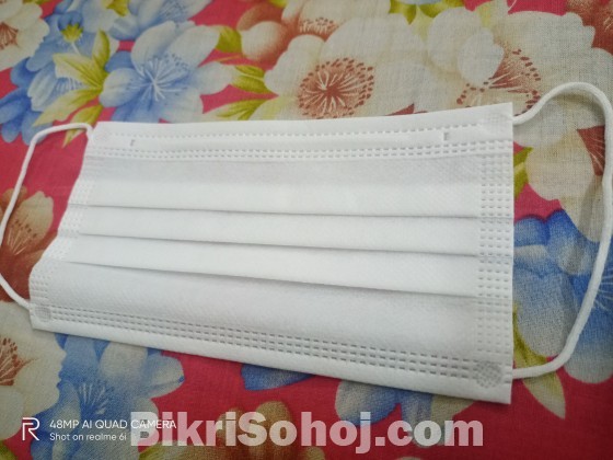 Surgical mask with nose pin